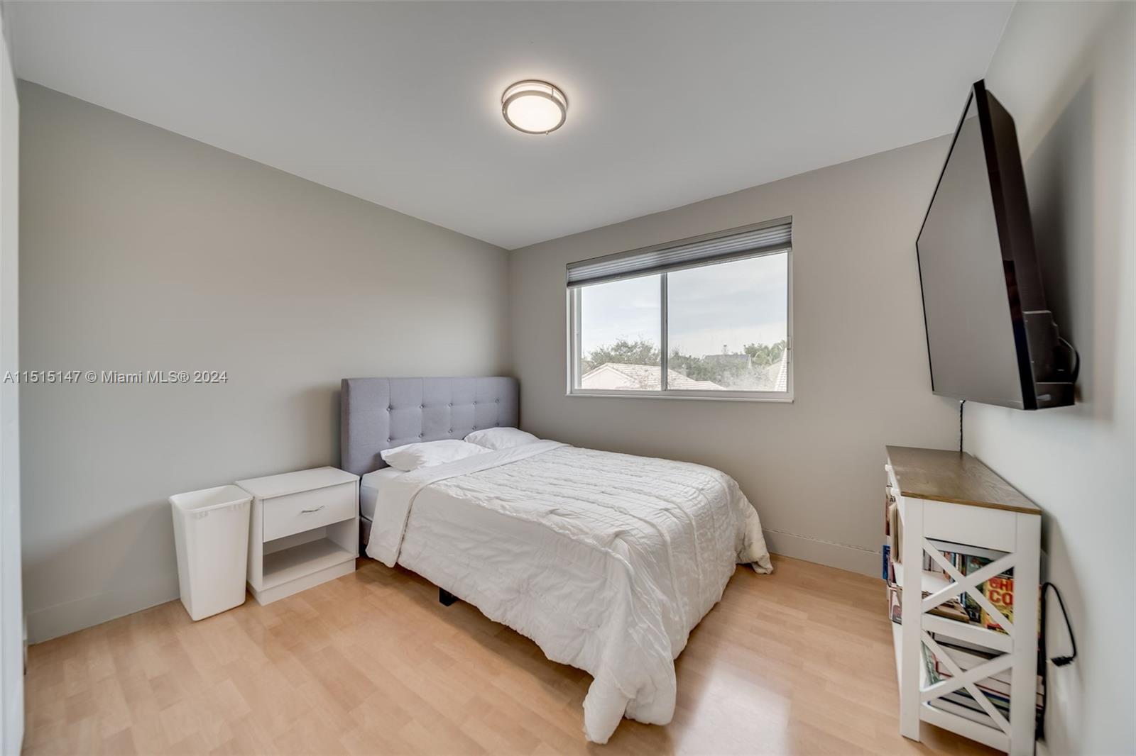 958 Briar Ridge Road Weston, FL 33327 - Photo 40 of 55 a bedroom with a bed and a flat screen tv