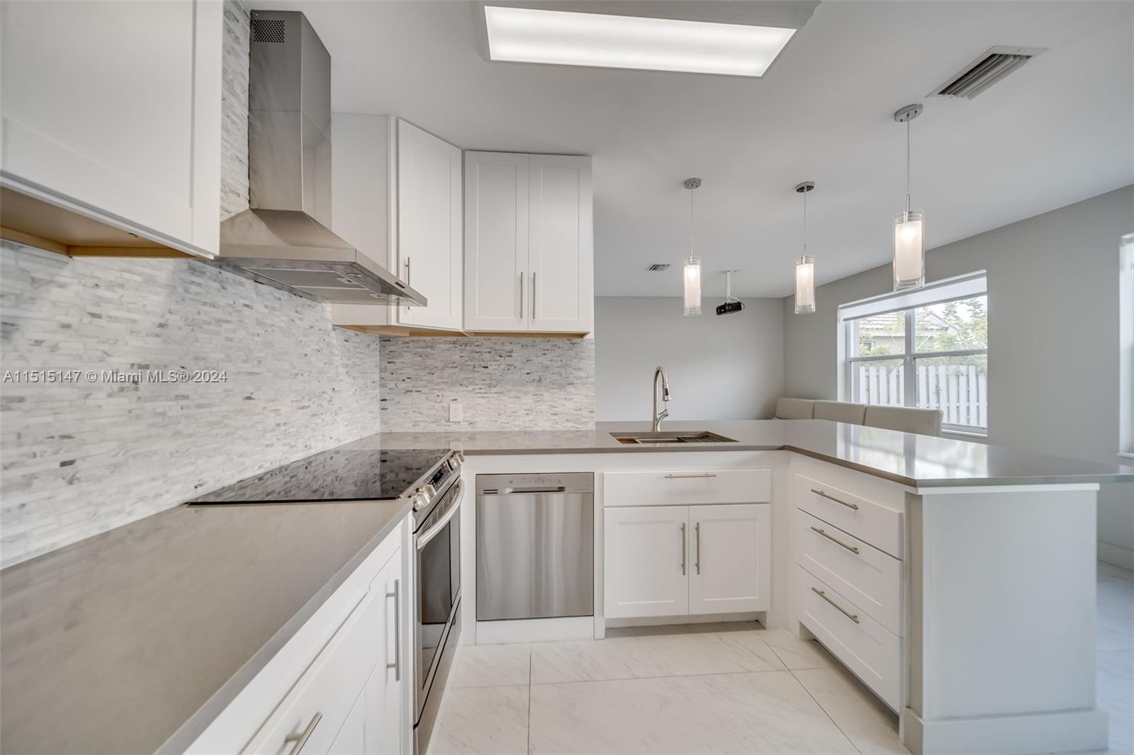 958 Briar Ridge Road Weston, FL 33327 - Photo 4 of 55 a kitchen with a sink stove and cabinets
