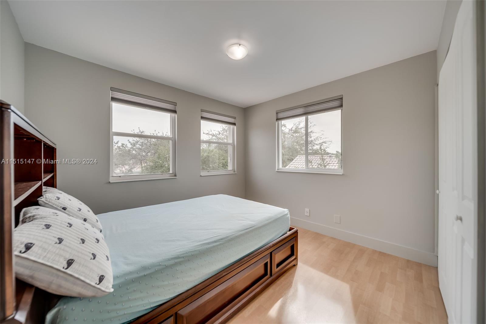 958 Briar Ridge Road Weston, FL 33327 - Photo 43 of 55 a bedroom with a bed and a window with wooden floor