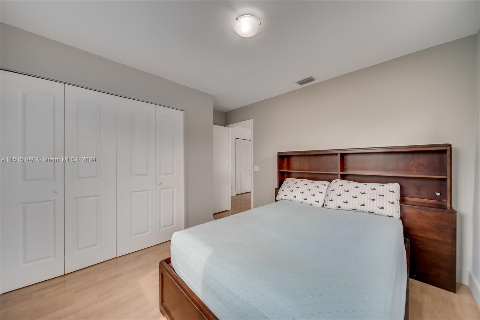 958 Briar Ridge Road Weston, FL 33327 - Photo 44 of 55 a large bed in a bedroom next to a cabinet
