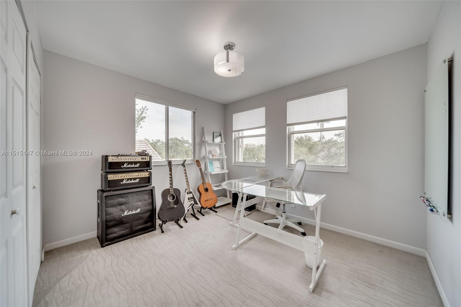 958 Briar Ridge Road Weston, FL 33327 - Photo 45 of 55 a bedroom with furniture and a large window