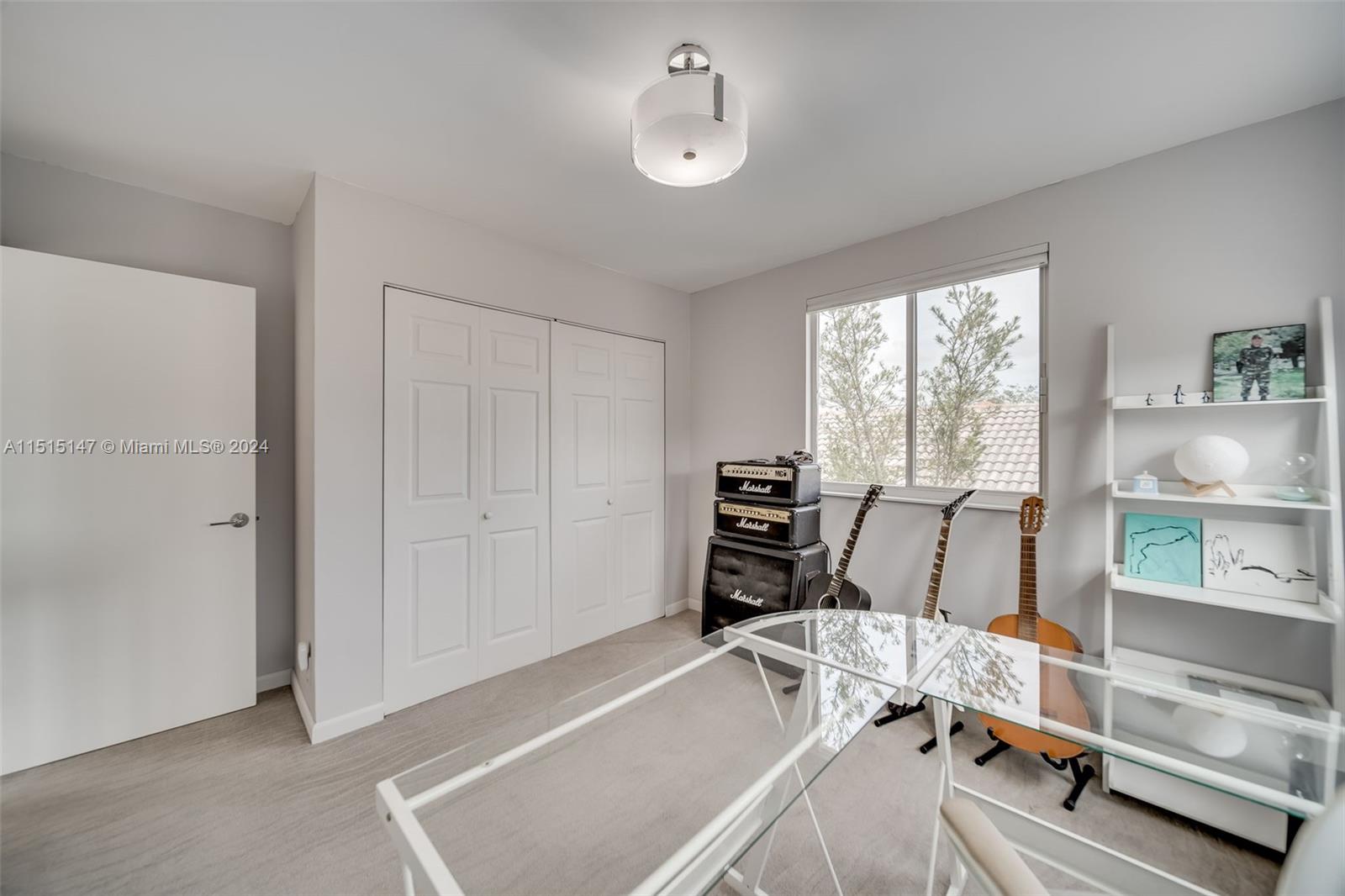 958 Briar Ridge Road Weston, FL 33327 - Photo 46 of 55 a room with a bed and a chandelier