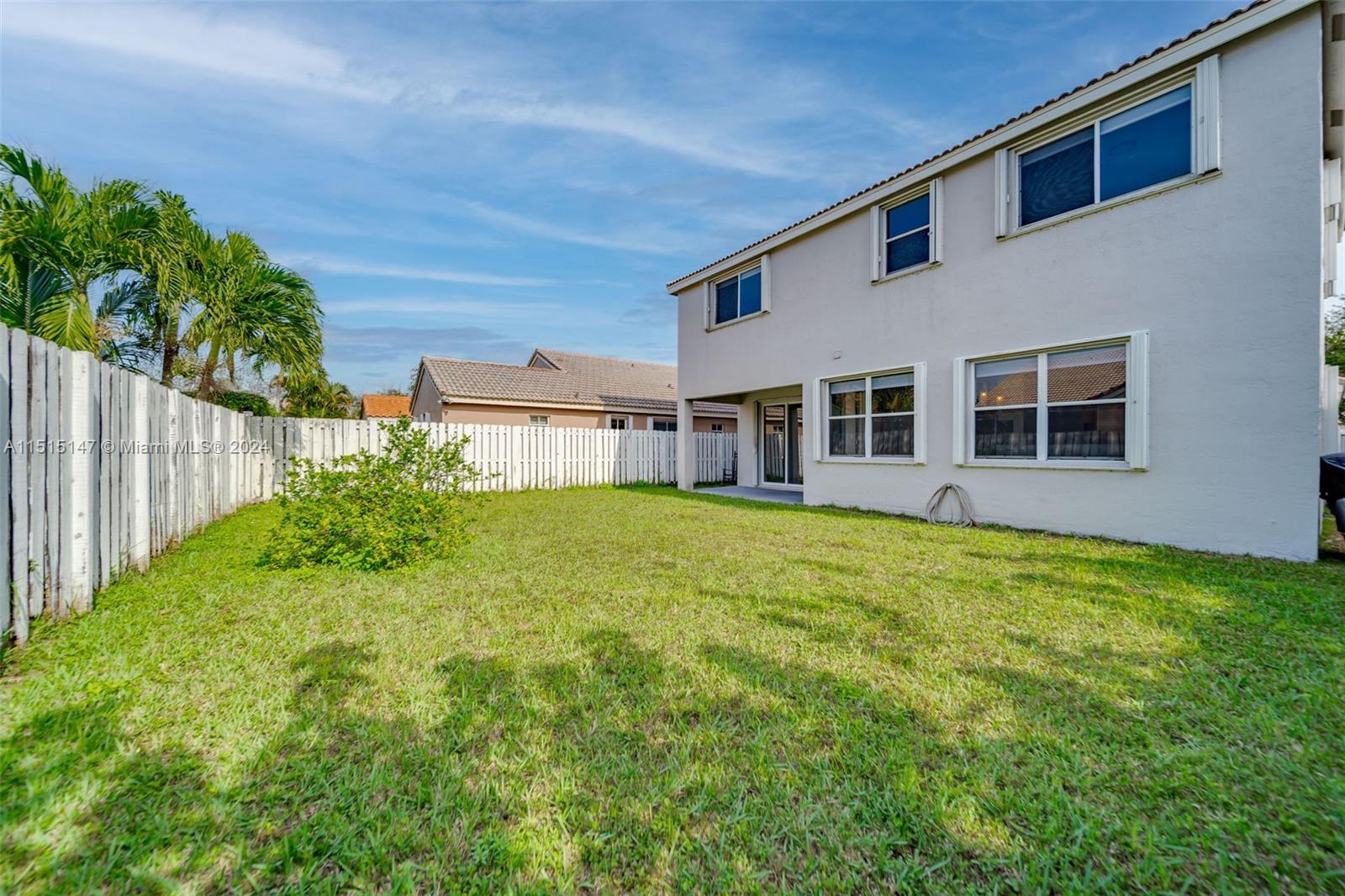 958 Briar Ridge Road Weston, FL 33327 - Photo 49 of 55 a house view with a garden space