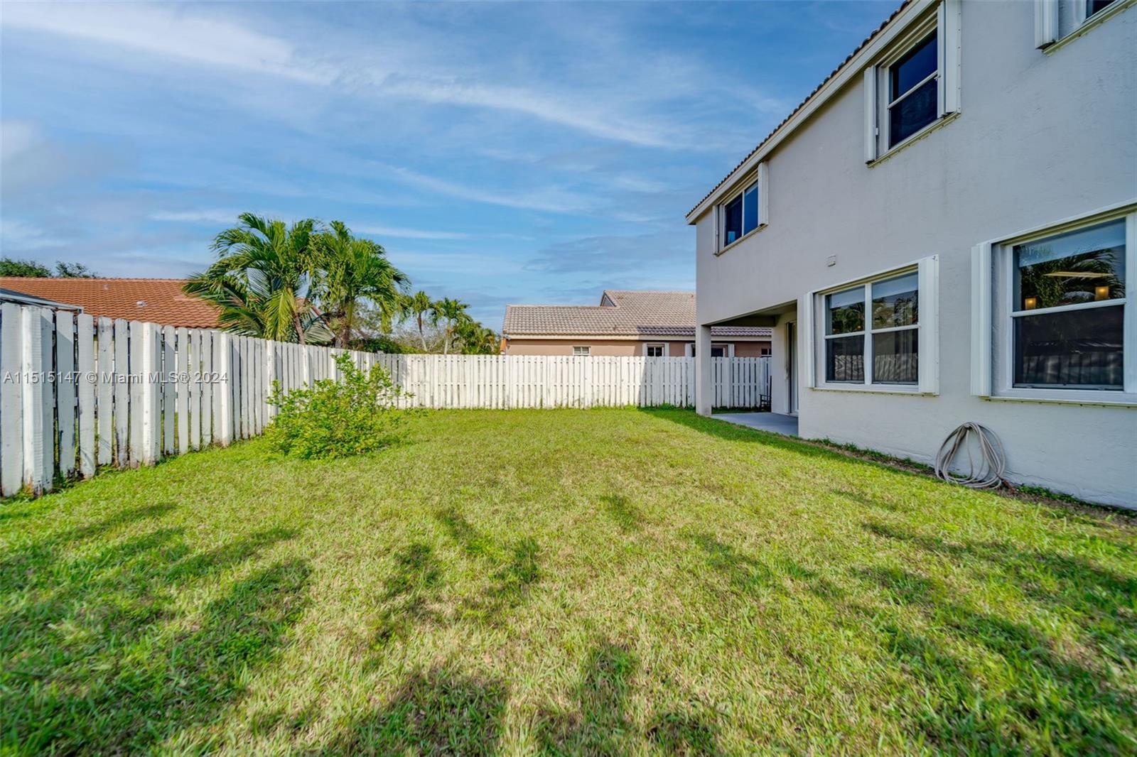 958 Briar Ridge Road Weston, FL 33327 - Photo 50 of 55 a house view with a garden space