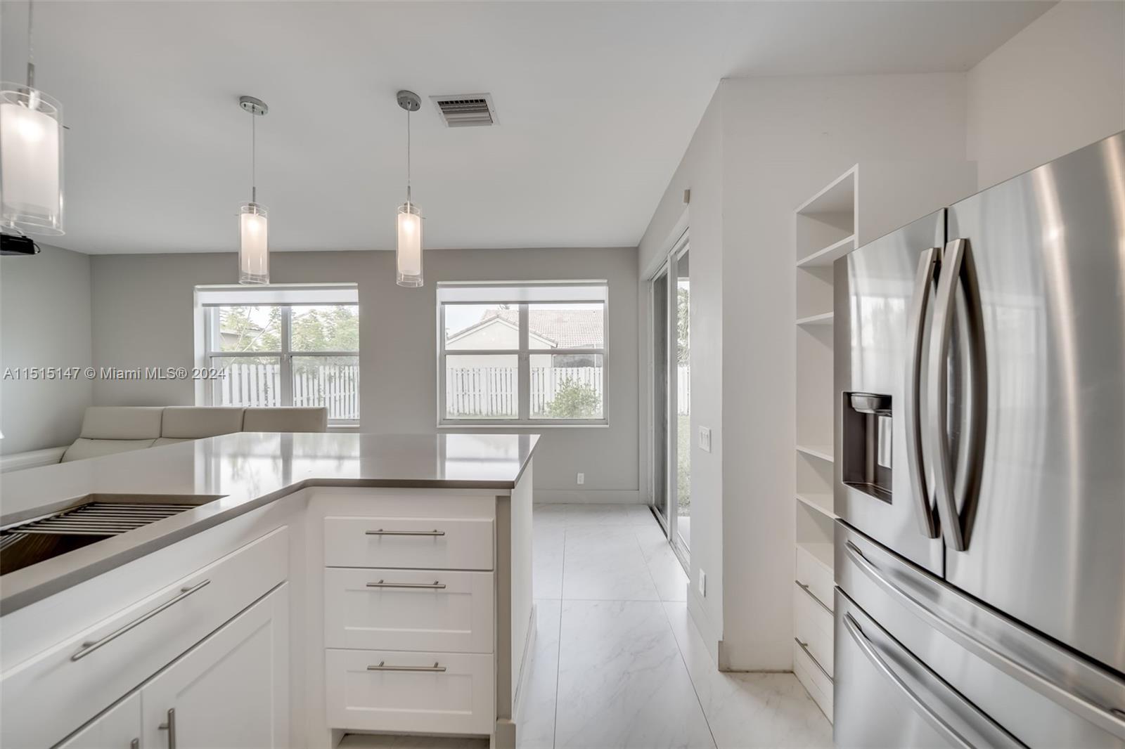 958 Briar Ridge Road Weston, FL 33327 - Photo 6 of 55 a kitchen with stainless steel appliances granite countertop a refrigerator and a sink