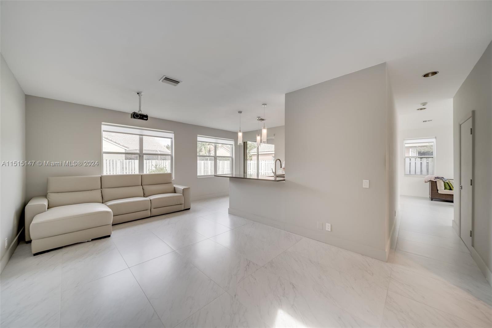 958 Briar Ridge Road Weston, FL 33327 - Photo 8 of 55 a living room with furniture and a large window