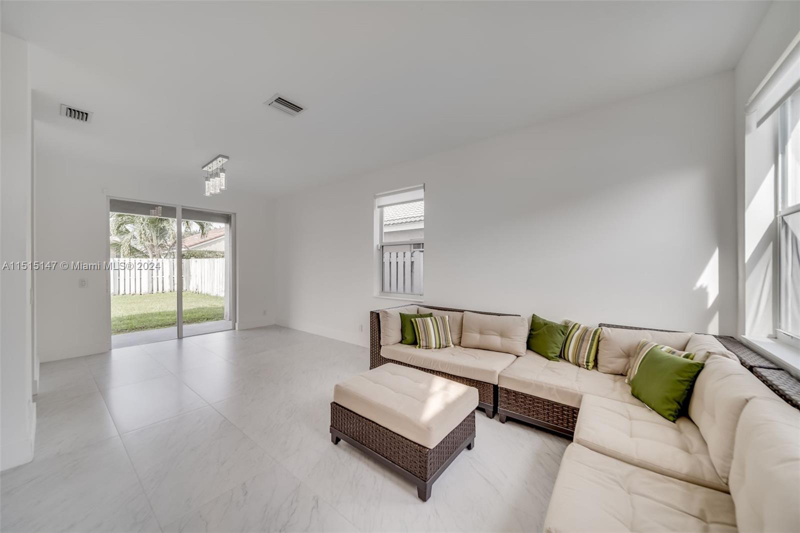 958 Briar Ridge Road Weston, FL 33327 - Photo 10 of 55 a living room with furniture and a window