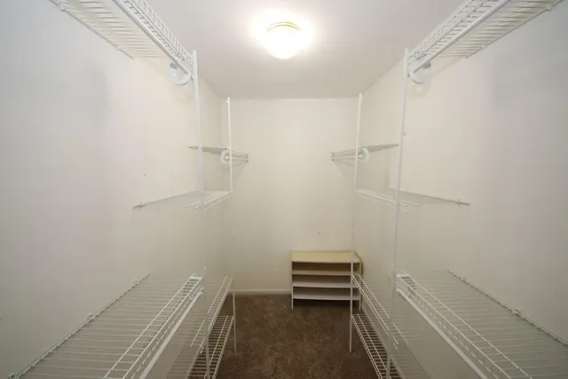 a view of room with walk in closet