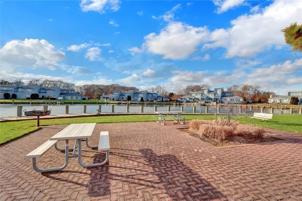 a view of a swimming pool and lounge chair