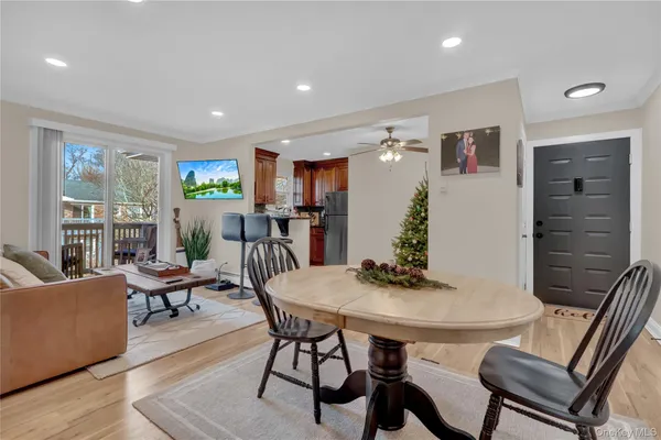 a view of a dining room with furniture and wooden floor