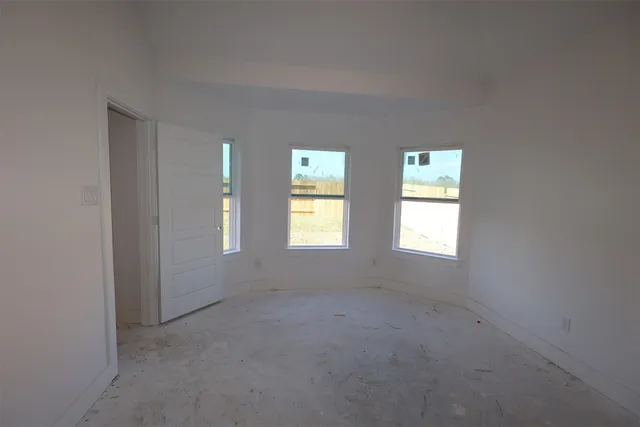 an empty room with windows