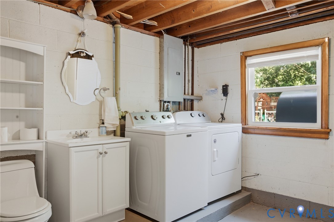8210 Ireton Road Henrico, VA 23228 - Photo 13 of 36 a bathroom with a sink a toilet and a mirror