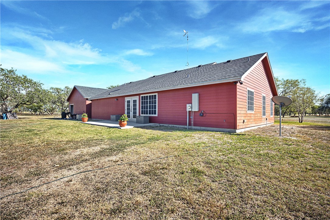 9227 Baker Road Sinton, TX 78387 - Photo 12 of 28 a view of a backyard with large trees