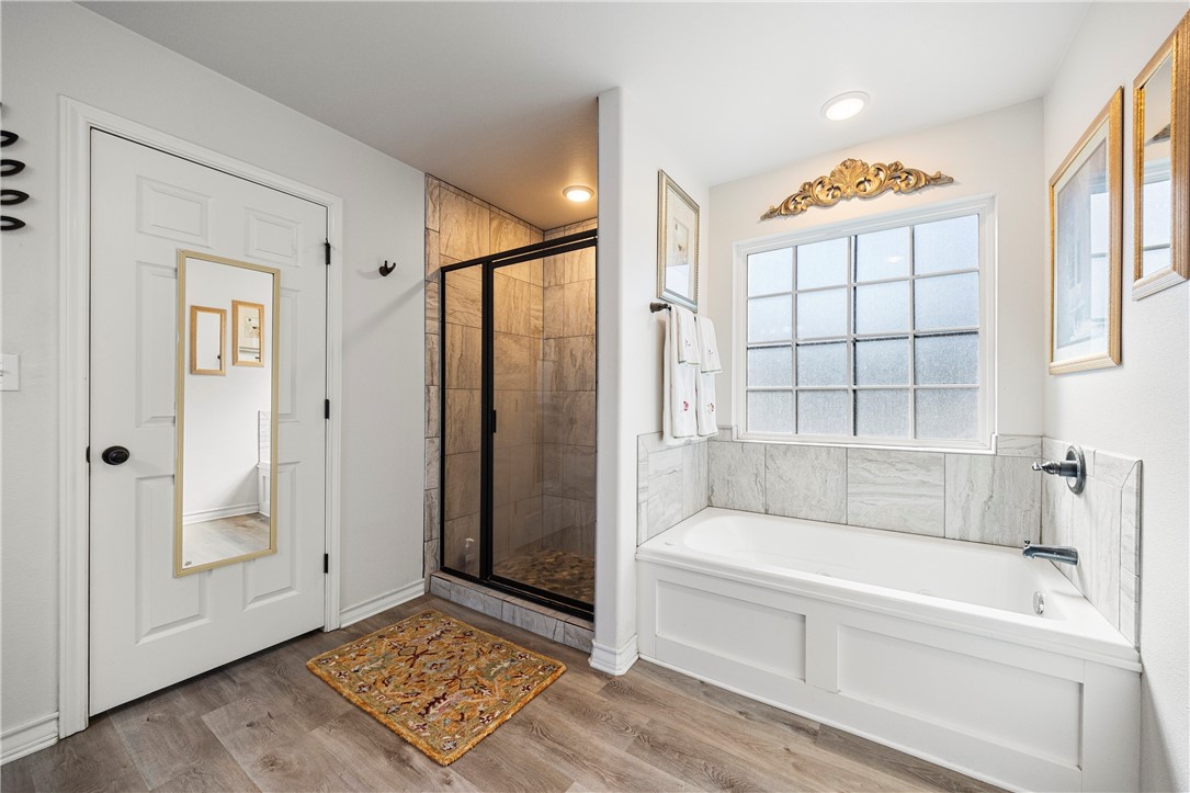 9227 Baker Road Sinton, TX 78387 - Photo 16 of 23 a bathroom with a tub and shower