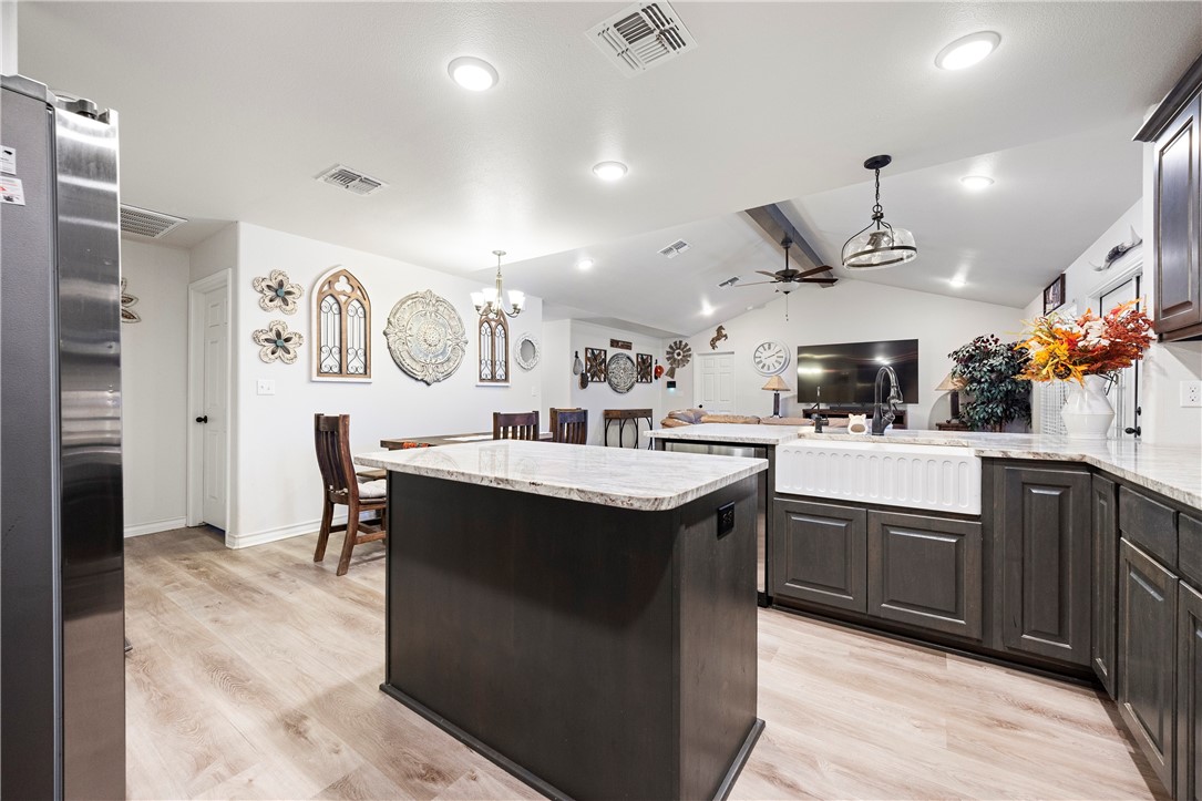 9227 Baker Road Sinton, TX 78387 - Photo 17 of 28 a kitchen with stainless steel appliances granite countertop a sink a stove and a refrigerator