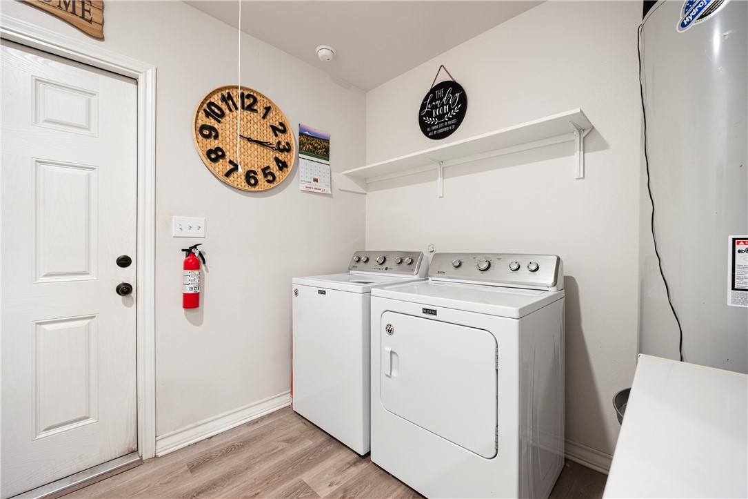 9227 Baker Road Sinton, TX 78387 - Photo 22 of 23 a utility room with dryer and washer