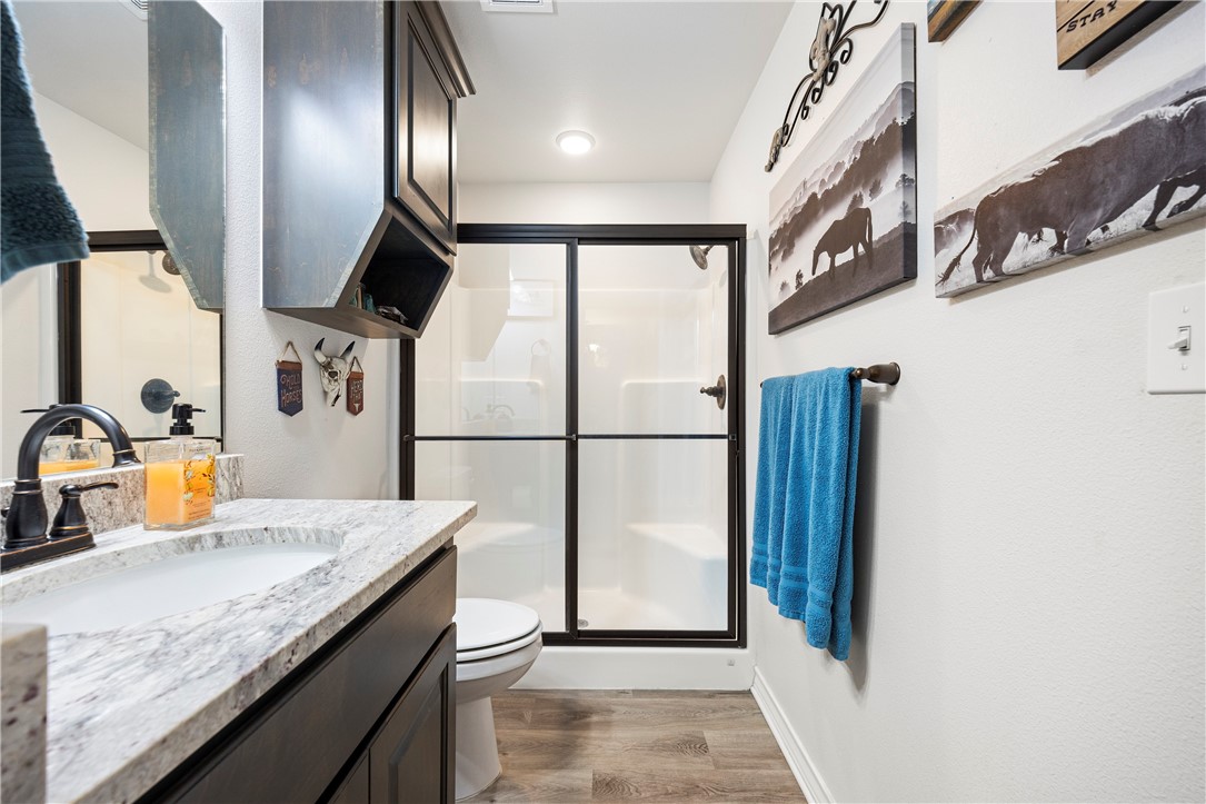 9227 Baker Road Sinton, TX 78387 - Photo 26 of 28 a kitchen with stainless steel appliances granite countertop a sink and a refrigerator
