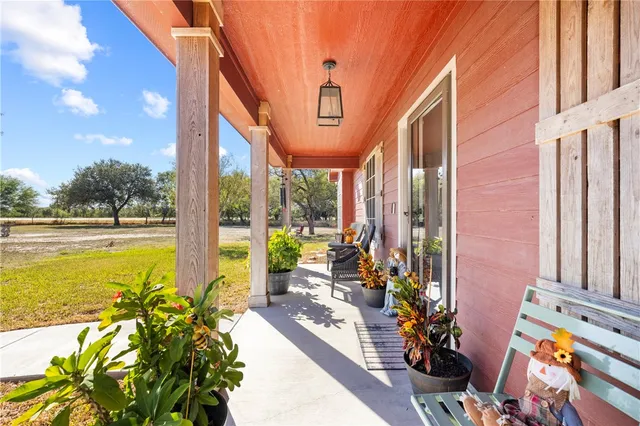 a front view of a house with outdoor seating