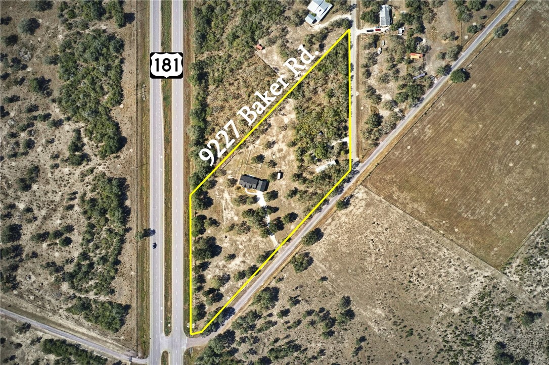 9227 Baker Road Sinton, TX 78387 - Photo 9 of 28 a sign board with street sign