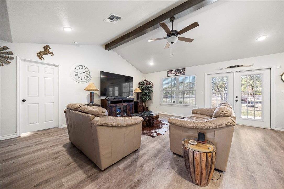 9227 Baker Road Sinton, TX 78387 - Photo 9 of 23 a living room with furniture and a flat screen tv