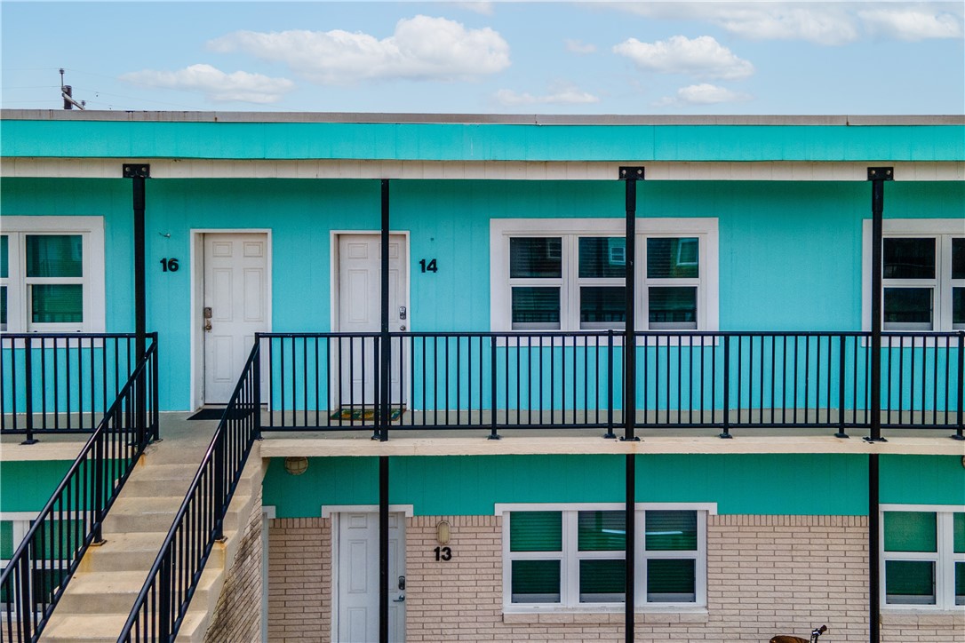 700 Island Retreat Road, Unit 14 Port Aransas, TX 78373 - Photo 2 of 23 an outdoor view of a house with a deck
