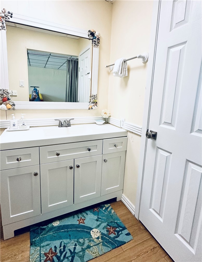 700 Island Retreat Road, Unit 14 Port Aransas, TX 78373 - Photo 23 of 23 a bathroom with a sink and a mirror