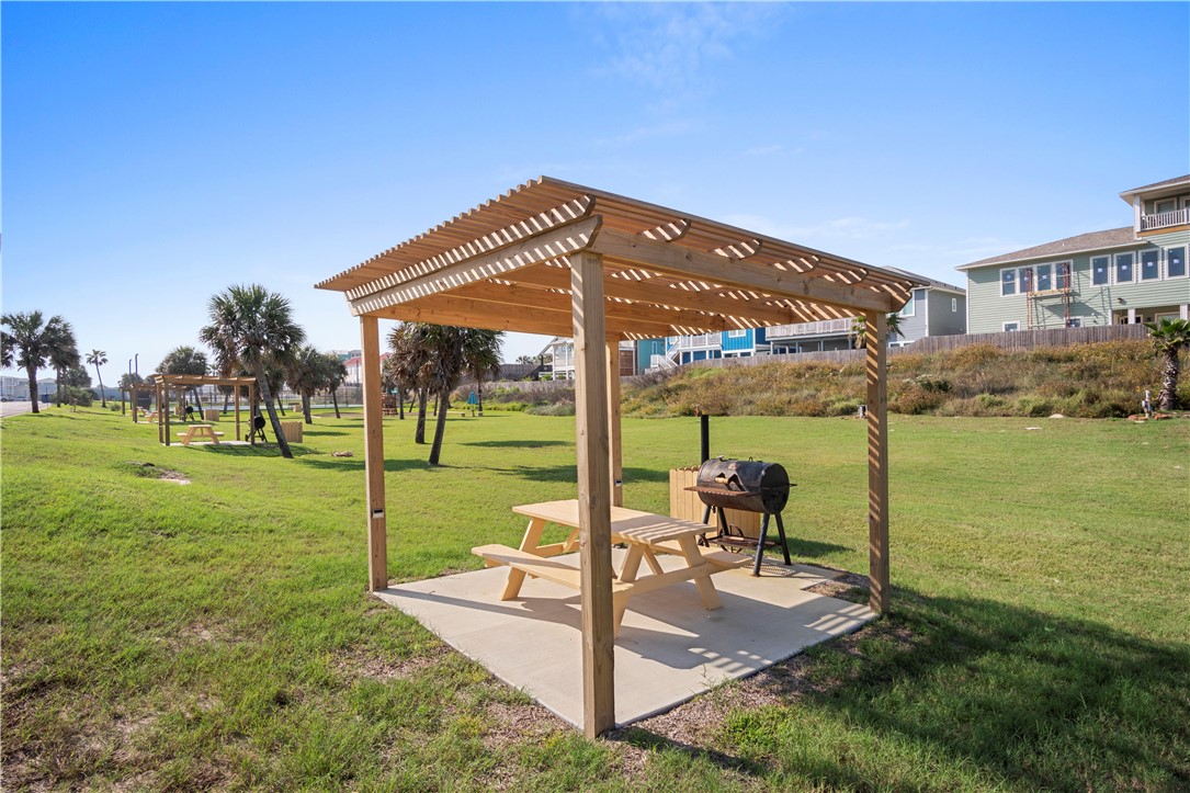 700 Island Retreat Road, Unit 14 Port Aransas, TX 78373 - Photo 9 of 23 a view of a garden with a slide