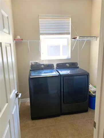 a room with a cabinets and a window