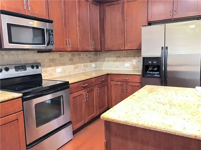 a kitchen with a stove and a microwave