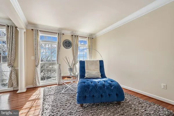 a living room with furniture and a rug