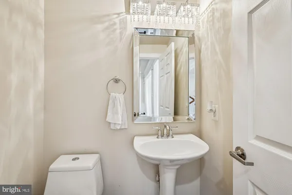 a bathroom with a sink a mirror and vanity