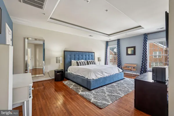 a bedroom with a bed and flat screen tv