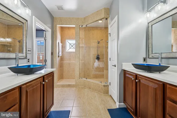 a hallway with sink and mirror