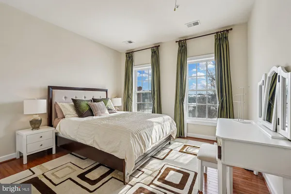 a bedroom with a bed and a table