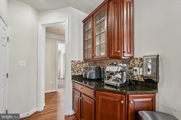 a kitchen with stainless steel appliances granite countertop a sink and a cabinets