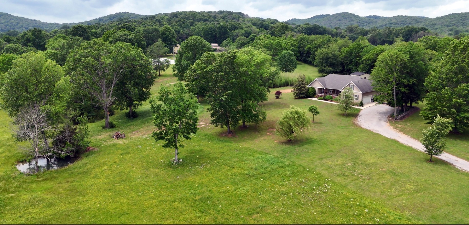 1157 Knox Road Readyville, TN 37149 - Photo 2 of 100 a view of a garden with a fountain