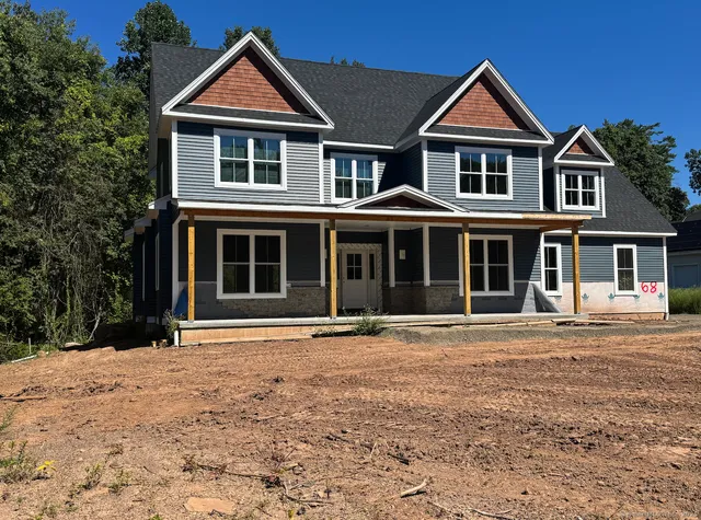 front view of a house with a yard