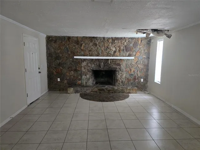 a living room with a fireplace