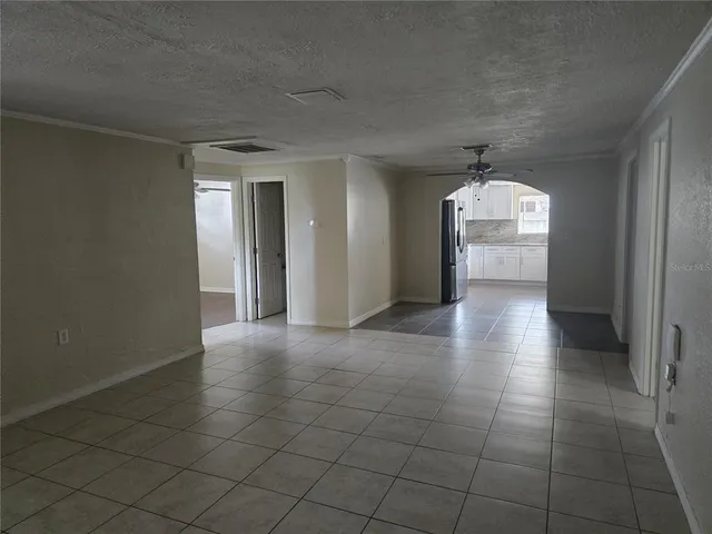 a view of a hallway with wooden shelves