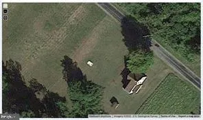 view of a house with a yard