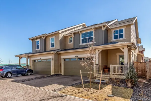 a front view of a house with parking space