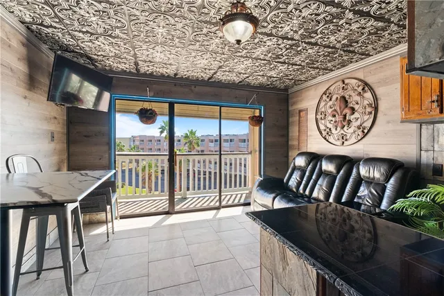 a view of a chairs and table in kitchen