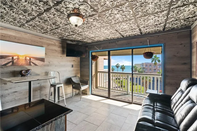 a outdoor space with patio furniture and a fireplace