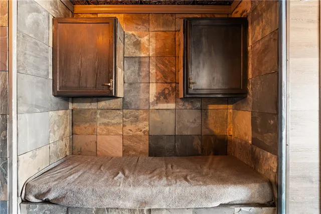 a bathroom with a sink a toilet a mirror and shower curtain