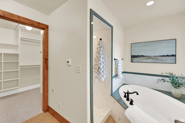 13658 South Fort Street Draper, UT 84020 - Photo 26 of 87 Freestanding soaking tub with dark bronze fixtures set against a white and green paneled wall