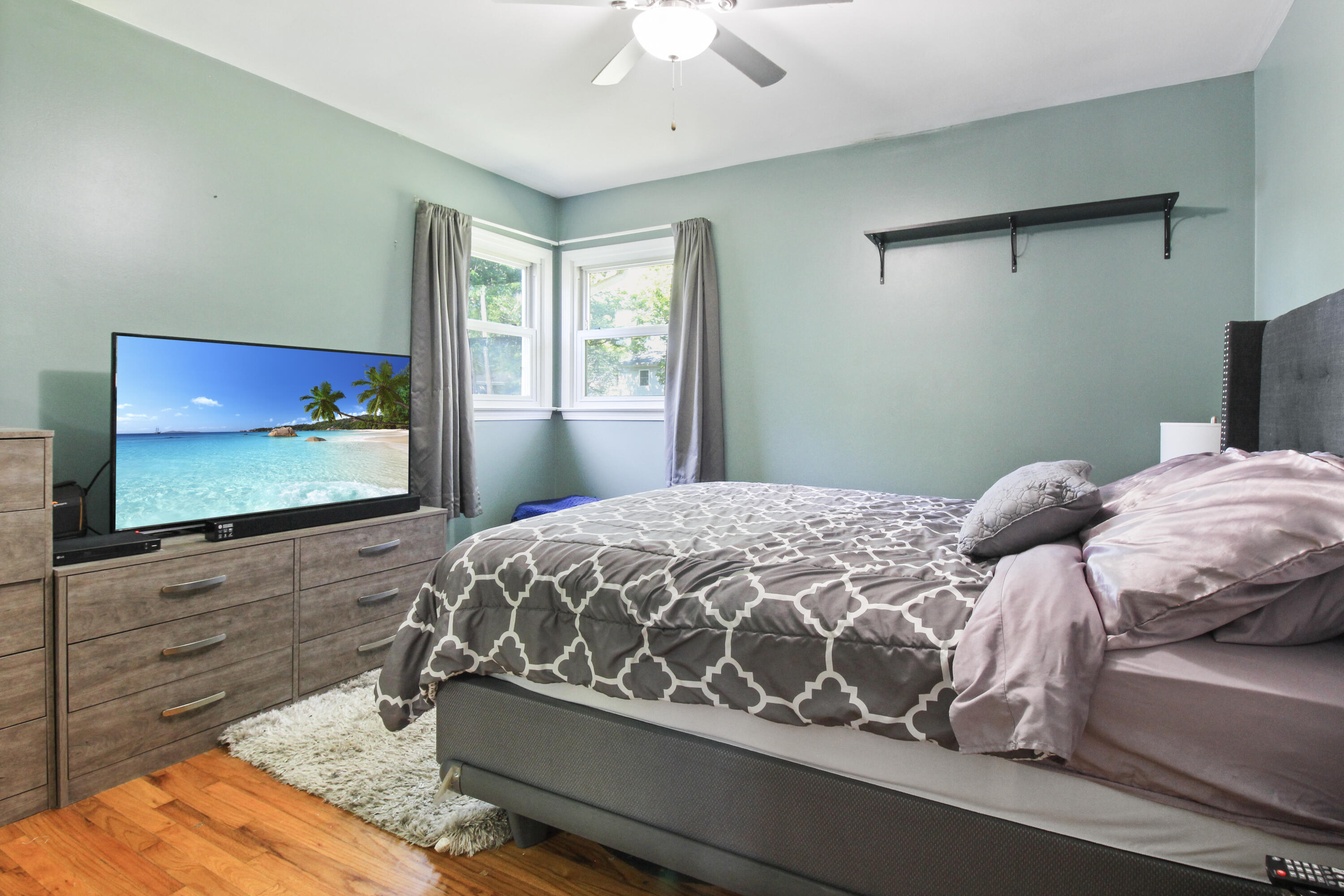 7714 Wallace Street Merrillville, IN 46410 - Photo 10 of 14 a bedroom with a bed and window