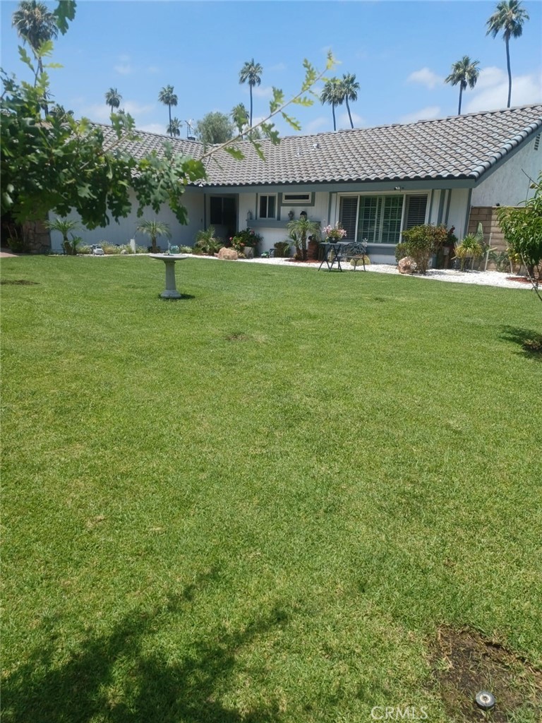 9849 Canada Way Riverside, CA 92503 - Photo 1 of 1 a front view of a house with a garden