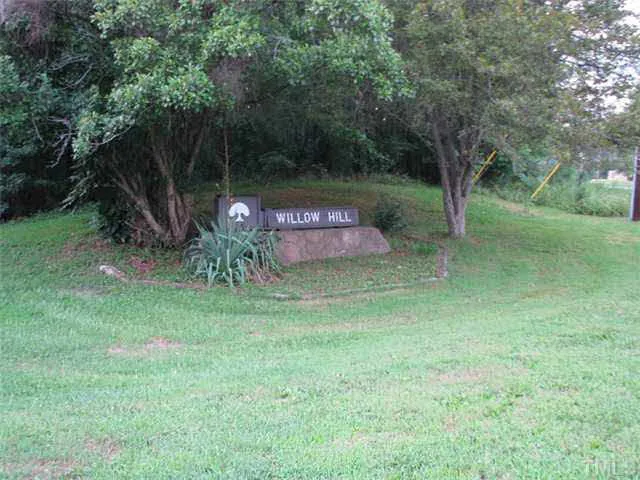 a view of outdoor space with deck and yard