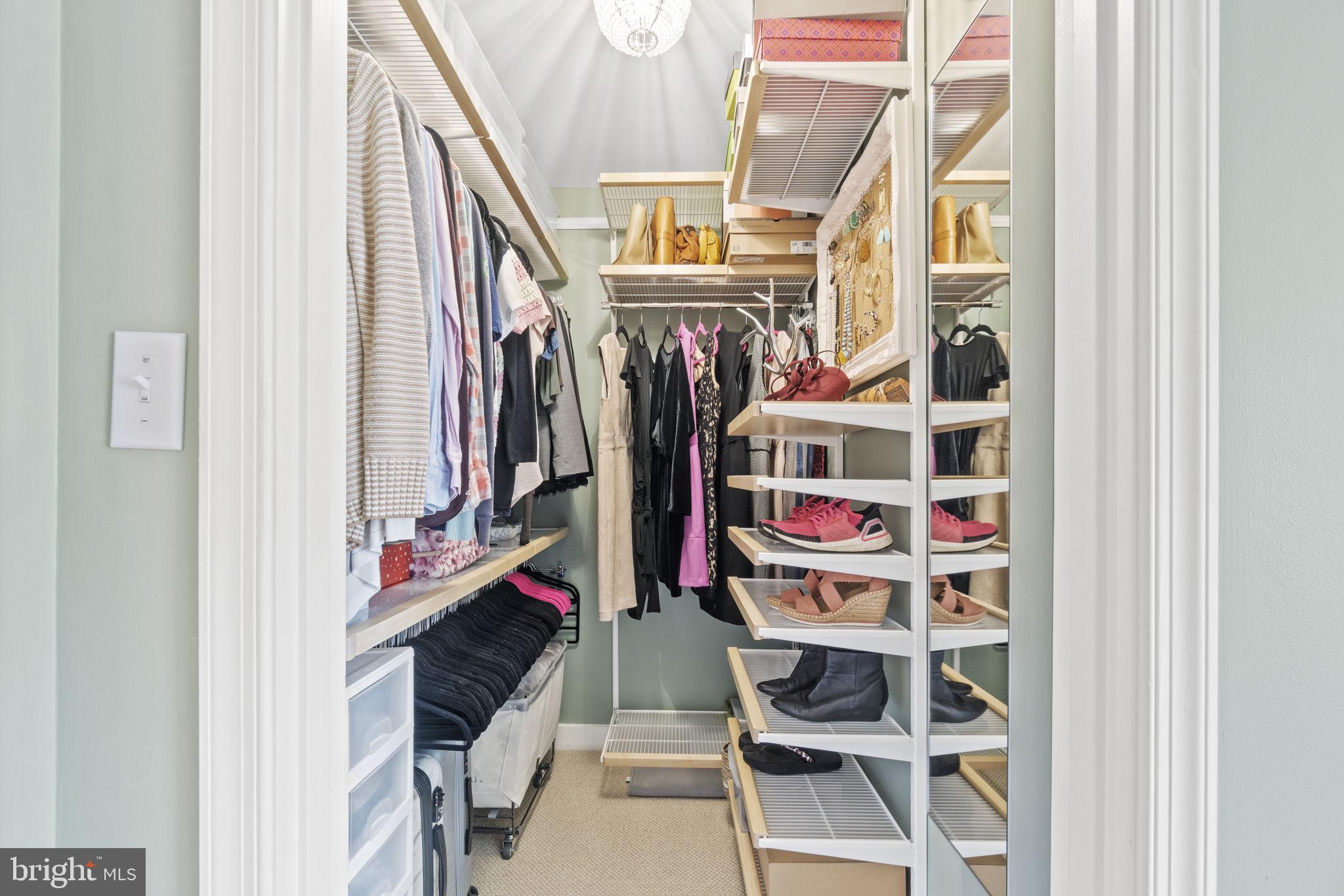 675 E Street Northwest, Unit 500 Washington, DC 20004 - Photo 17 of 52 a view of walk in closet with clothes and shoes