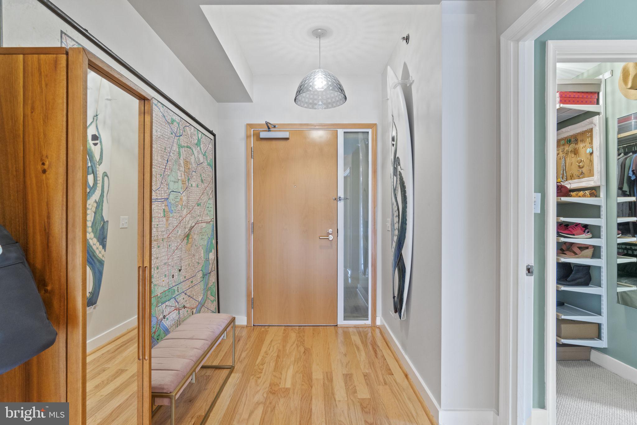 675 E Street Northwest, Unit 500 Washington, DC 20004 - Photo 2 of 52 a view of a hallway with wooden floor and entryway